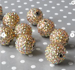 Detailed shot of 10-22mm resin rhinestone chunky beads, champagne AB color craft diy balls.