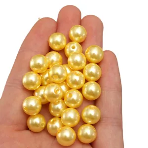 Cuentas de perlas de imitacion de plastico ABS amarillo oscuro para joyas DIY.