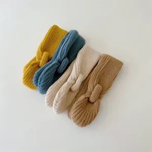Detailed view of soft knit baby neck warmers in multiple vibrant and neutral colors for kids.