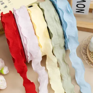 Close-up of 2.5cm ruffled pleated ribbon showcasing vibrant fabric trims for DIY bows and gift wrapping.