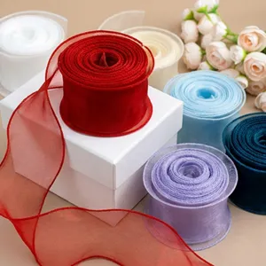 Detailed view of 6cm organza ribbon rolls in multiple colors for gift box and floral packaging.