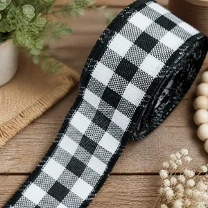 Detailed close-up shot of black and white checkered fabric ribbon for floral wrapping DIY.