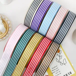 Close-up of colorful striped grosgrain ribbons, perfect for DIY hair bows and gift wrapping.