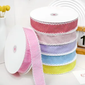 Checked fabric ribbon detail showing multiple colorful spools with fringed edges for DIY craft.