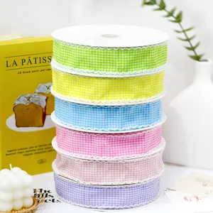 Close-up detail of 4cm colorful gingham ribbon with lace trim for gift wrapping and DIY crafts.