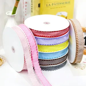 Close-up detail of colorful plaid ribbons with scalloped edge for DIY crafts and decor.