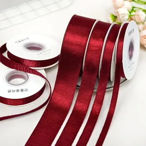Double-sided shiny wine red velvet ribbon rolls for DIY hair bows and gift wrapping.