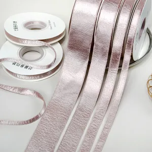 Premium pink metallic velvet ribbon rolls for DIY crafts, gift wrapping and hair bows.