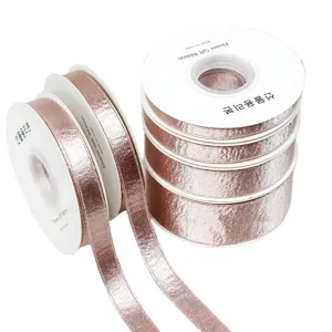 Pink shiny ribbon rolls for gift wrapping and DIY crafts hair bows clothing accessories.