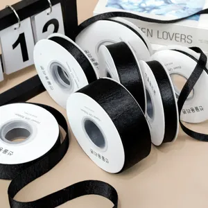 Black satin ribbon rolls for DIY hair bows and garment accessories, 1-3.8cm width, shiny finish.