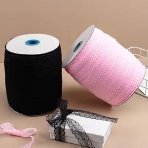 Large spools of black and pink lace trim rolls for DIY crafts, gift packaging and wedding decor.
