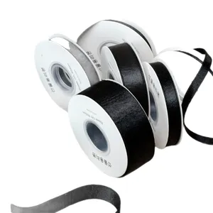Black satin ribbon rolls for DIY hair bows, gift wrapping, and garment sewing accessories.