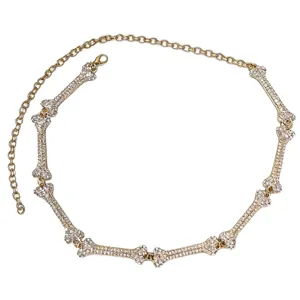 Gold-tone rhinestone bone chain belt for women, gothic fashion waist jewelry accessory.