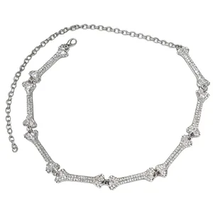 Rhinestone bone body chain, silver waist jewelry for women, punk gothic fashion accessory.