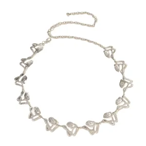Silver metal chain belt detail view featuring retro floral links and adjustable length design.