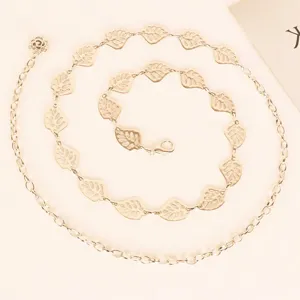 Elegant gold-colored metal leaf chain belt for women, stylish dress waist accessory.