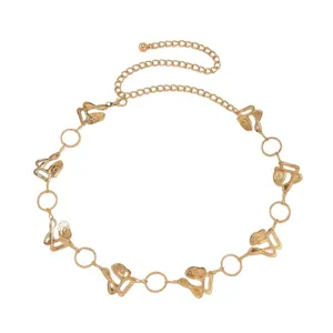 Gold metal chain belt for women, adjustable waist accessory with abstract charms and rings.
