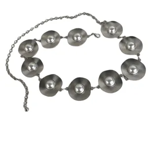 Metal waist chain detail showcasing geometric pearl discs and delicate link design for women.