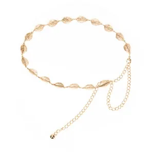 Gold metal leaf waist chain detail view, elegant accessory showing fine leaf link design.