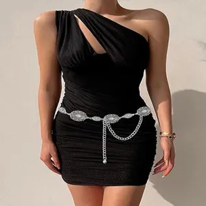 Retro bohemian metal waist chain with delicate carved buckle design, chic dress accessory.