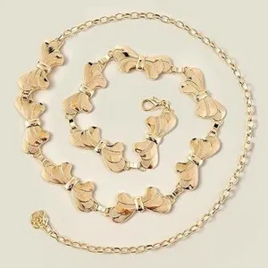 Chaine de taille doeree en metal pour femmes, ceinture elegante avec noeud pour jolies robes.