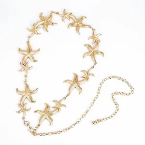 Gold starfish chain detail, ocean style metal jewelry accessory for women, stylish waist chain.