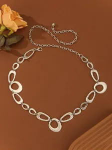 Detailed shot of European and American style metal waist chain, geometric ring design for women dresses.