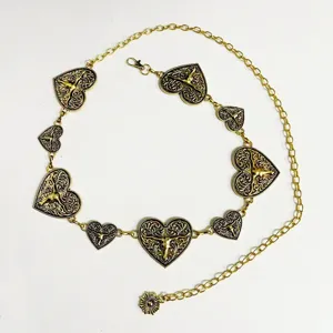 Gold metal chain belt with heart pendants, vintage waist accessory for women fashion dress.