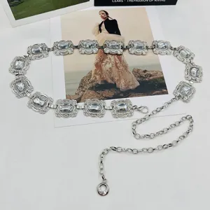 Exquisite metal waist chain for women featuring sparkling gemstone links, stylish dress accessory.