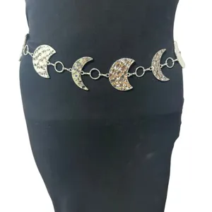 Close up of a retro silver crescent moon metal waist chain, delicate link design.