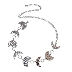 Detailed view of the retro silver metal waist chain featuring stylish crescent moon phase charms.