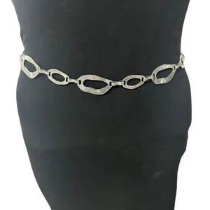 Detailed view of vintage silver metal geometric cutout link waist chain belt fashion