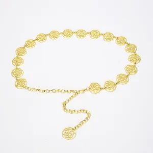 Gold metal chain belt with hollow camellia flower design, delicate detail view for dresses.