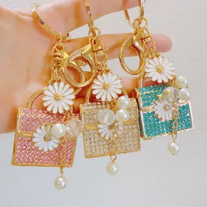 Cute Metal Rhinestone Daisy Handbag Keychain Artificial Pearl Tassel Mini Bag Pendant Creative Zinc Alloy Flower Bag Charm Jewelry Gift For Women