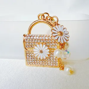 Cute rhinestone mini handbag keychain with daisy flower and pearl pendant for women