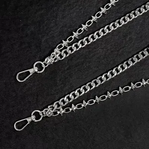 Detailed view of punk multi-layer metal pants chain with spike design, cool streetwear accessory.