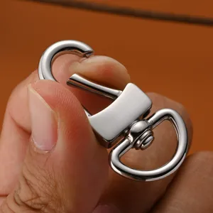 Close-up view of a stainless steel swivel snap hook with spring gate for bags and keychains.
