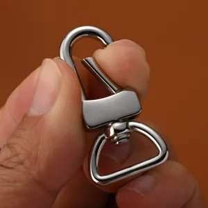 Stainless steel swivel snap hook, polished metal dog clip for bags and hardware accessories detail.
