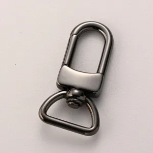 Close-up detail of metal bag swivel snap hook, durable stainless steel hardware accessory.