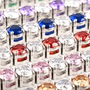 Close-up detail of colorful cubic zirconia tennis chains, stainless steel metal link bracelets.