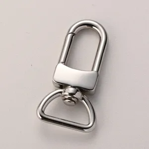 Stainless steel swivel snap hook detail, polished metal bag hardware accessory, durable clasp.