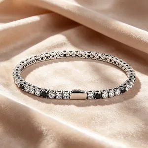 Stainless steel tennis bracelet with alternating black and white cubic zirconia stones for daily wear.