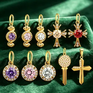 Detailed shot of gold-plated stainless steel cubic zirconia charms, various designs.