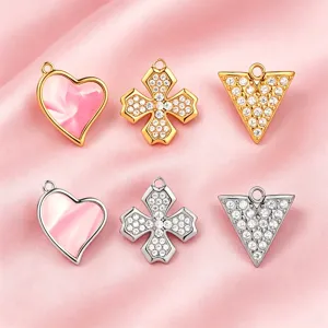 Set of 6 DIY metal charms featuring heart, rhinestone cross and triangle designs in gold and silver.
