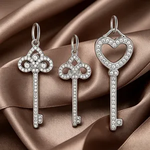 Silver key pendants set with sparkling cubic zirconia, heart and floral designs for DIY jewelry.