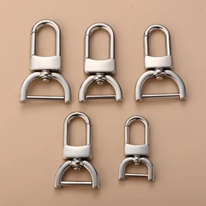 Stainless steel swivel snap hooks hardware details for bags and car keychains.