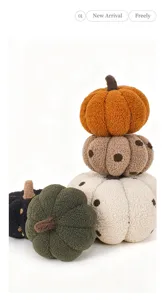 Close-up detail of cute pumpkin plush pillows in assorted colors with cozy soft fabric finish.