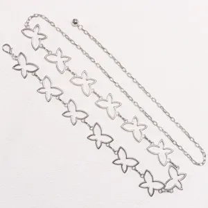 Close-up detail of the fashion silver metal hollow butterfly chain belt for dresses.
