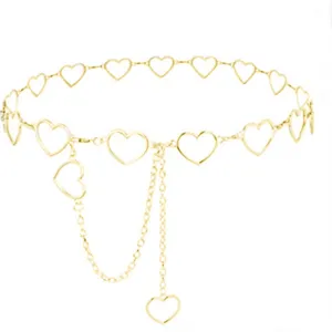 Gold hollow heart metal waist chain punk style body chain fashionable trousers accessory detail.