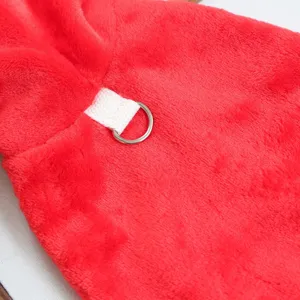 Detailed close-up view of the soft red plush pet Christmas cape showcasing the metal ring.
